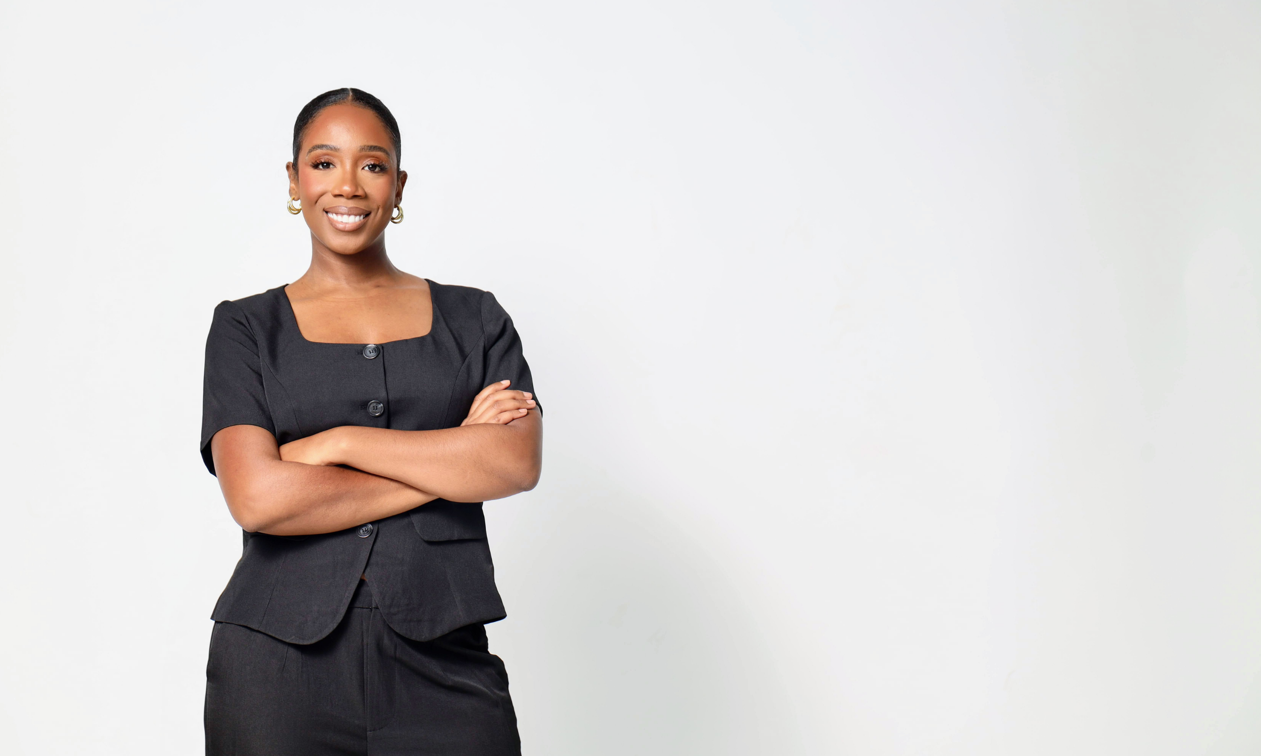 Cierra Gross, founder and CEO of Worklution, standing with arms crossed